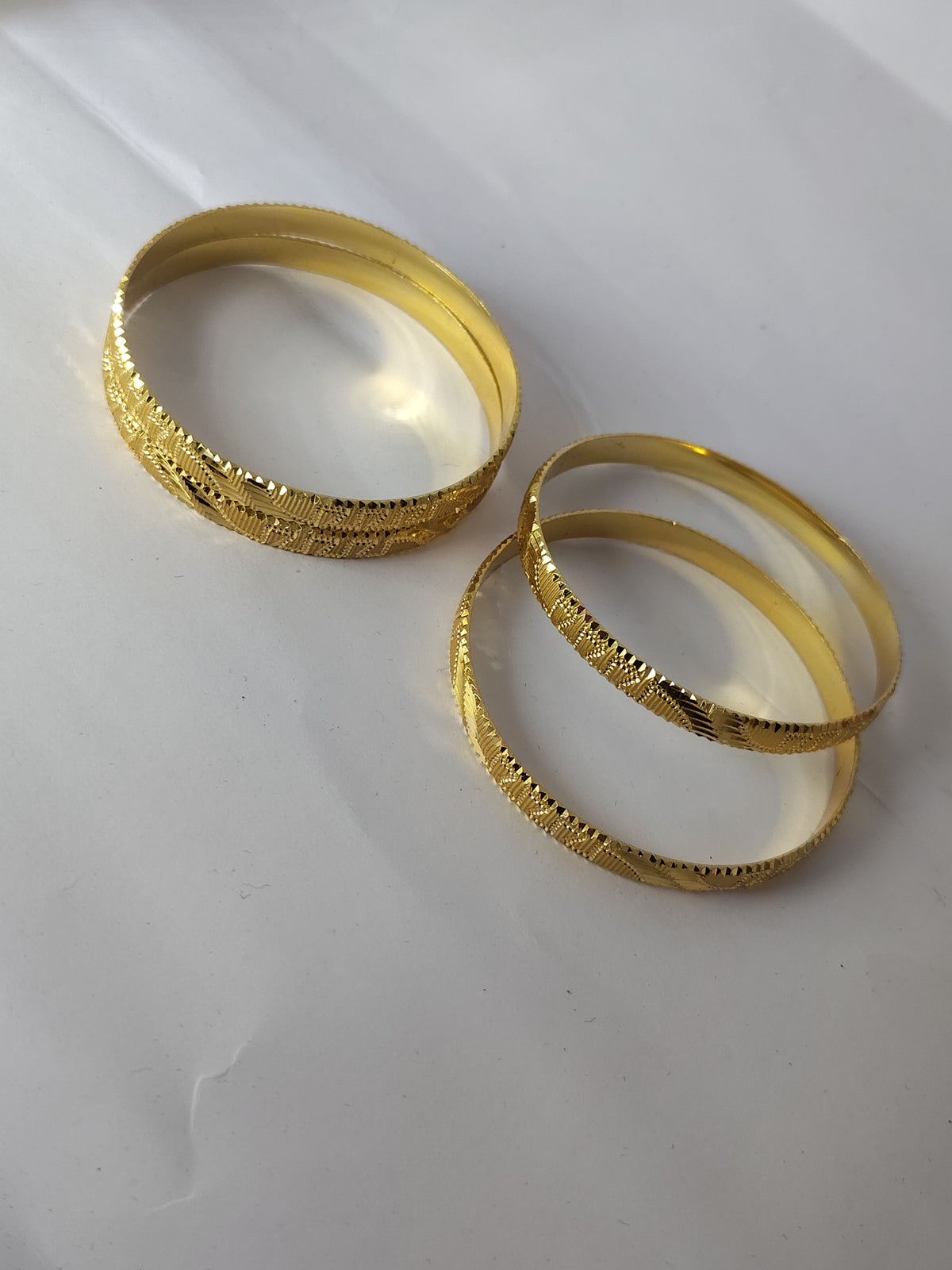 Elegant Gold-Plated Textured Designer Bangles for Women (Set of 4)
