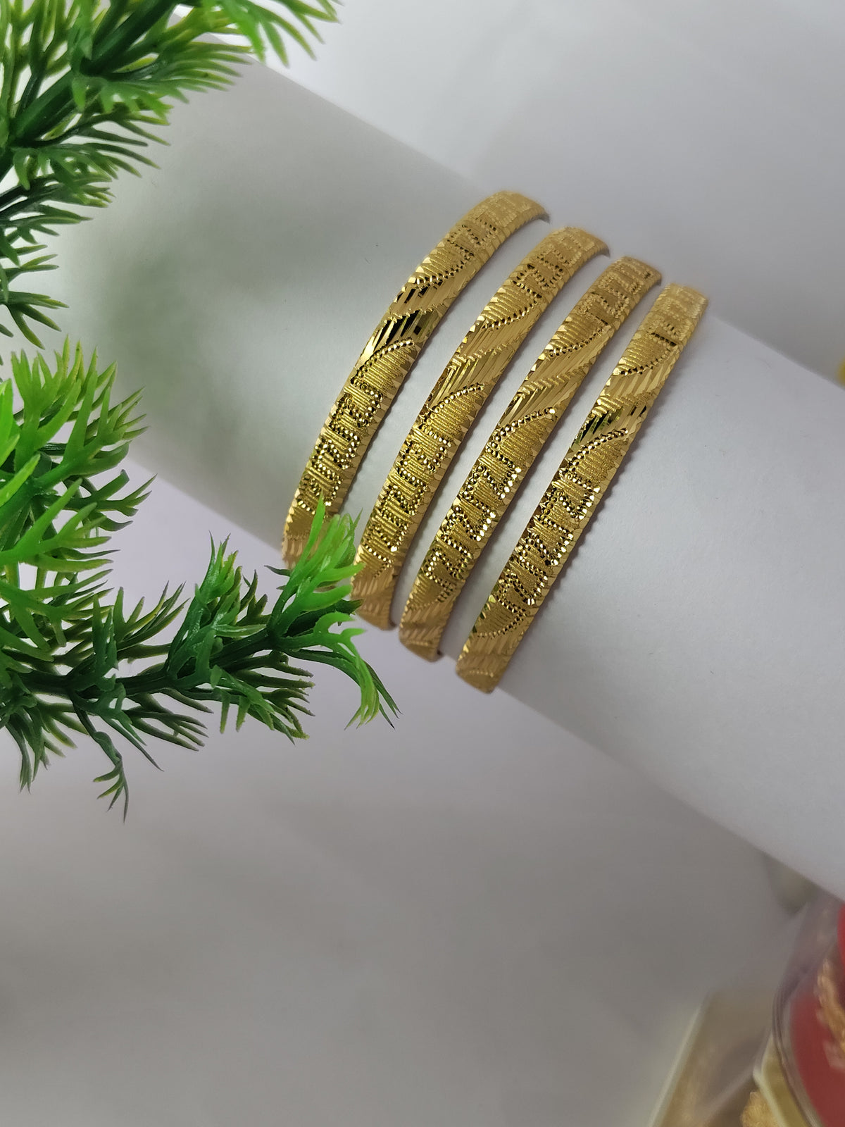 Elegant Gold-Plated Textured Designer Bangles for Women (Set of 4)