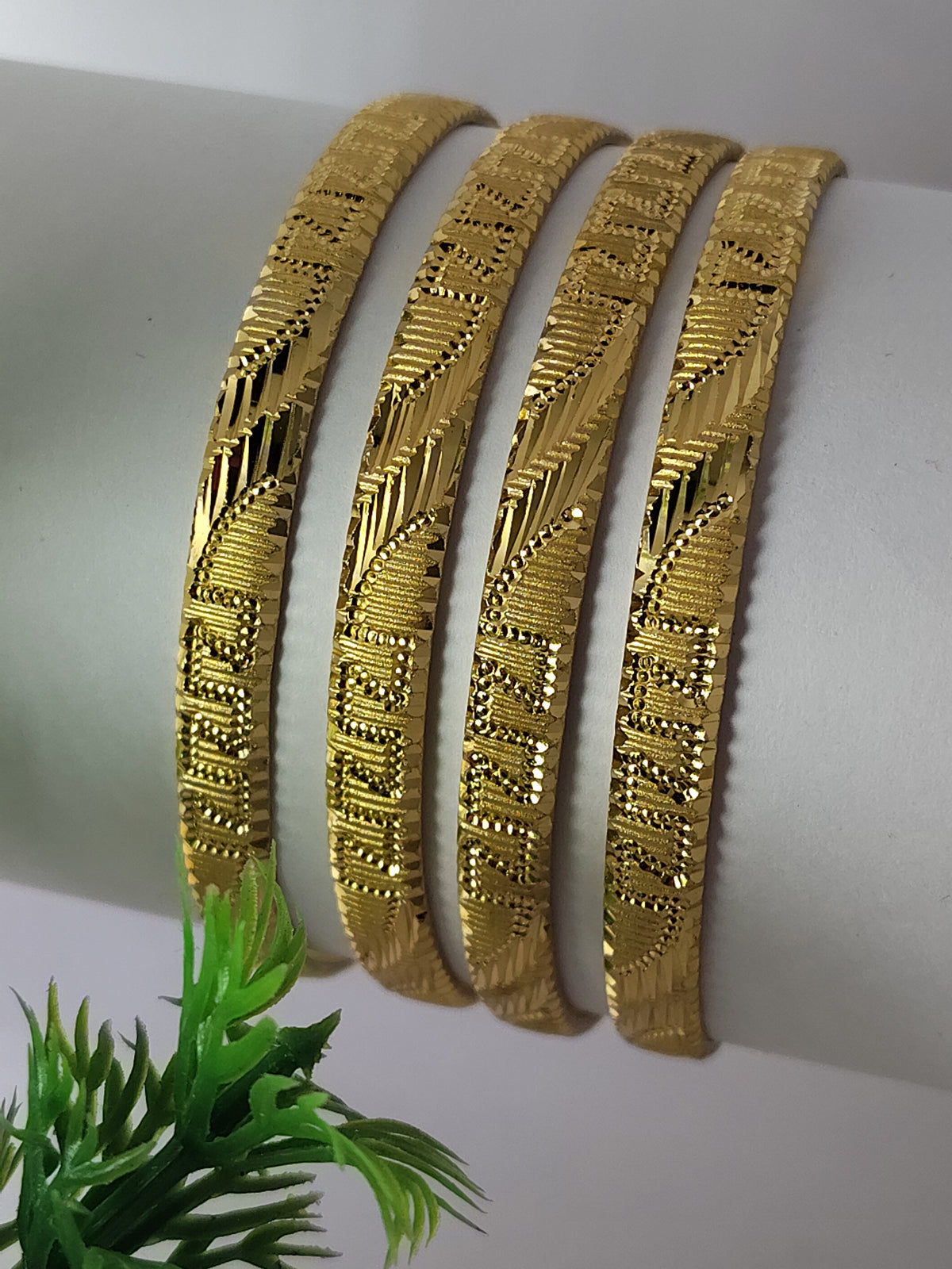 Elegant Gold-Plated Textured Designer Bangles for Women (Set of 4)