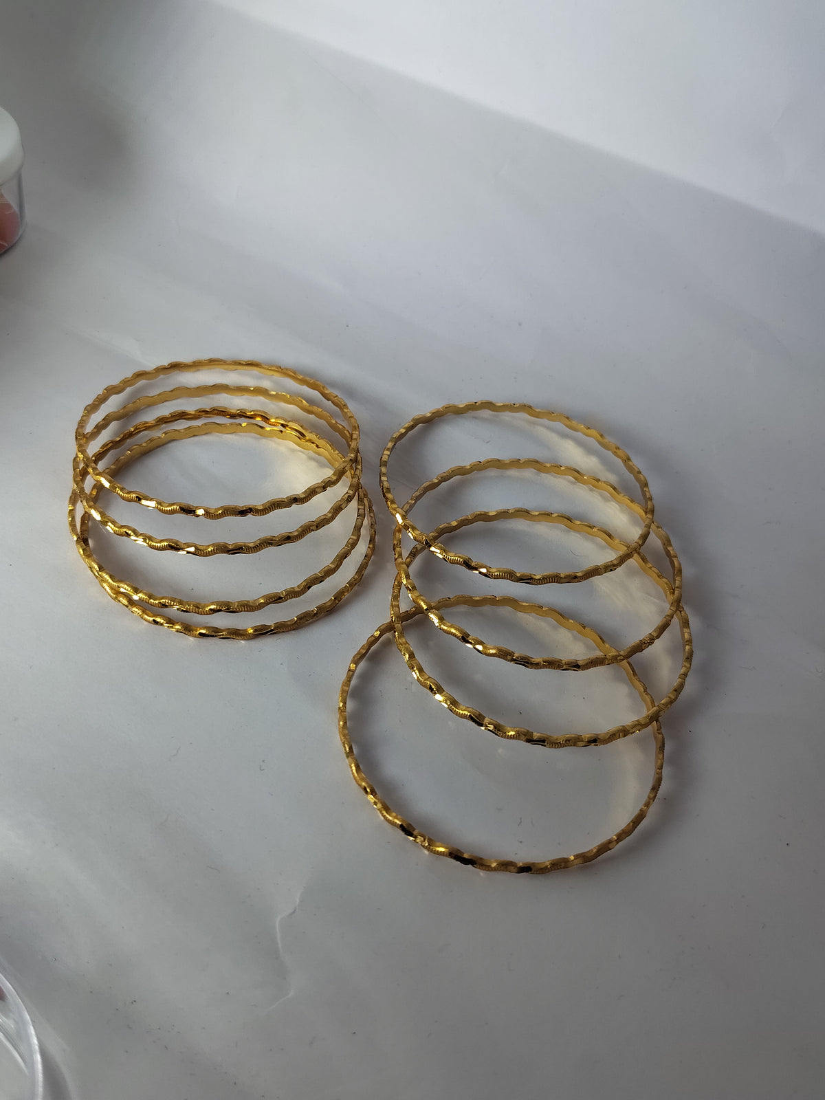 Elegant Gold-Plated Twisted Wave Designer Bangles for Women (Set of 8)