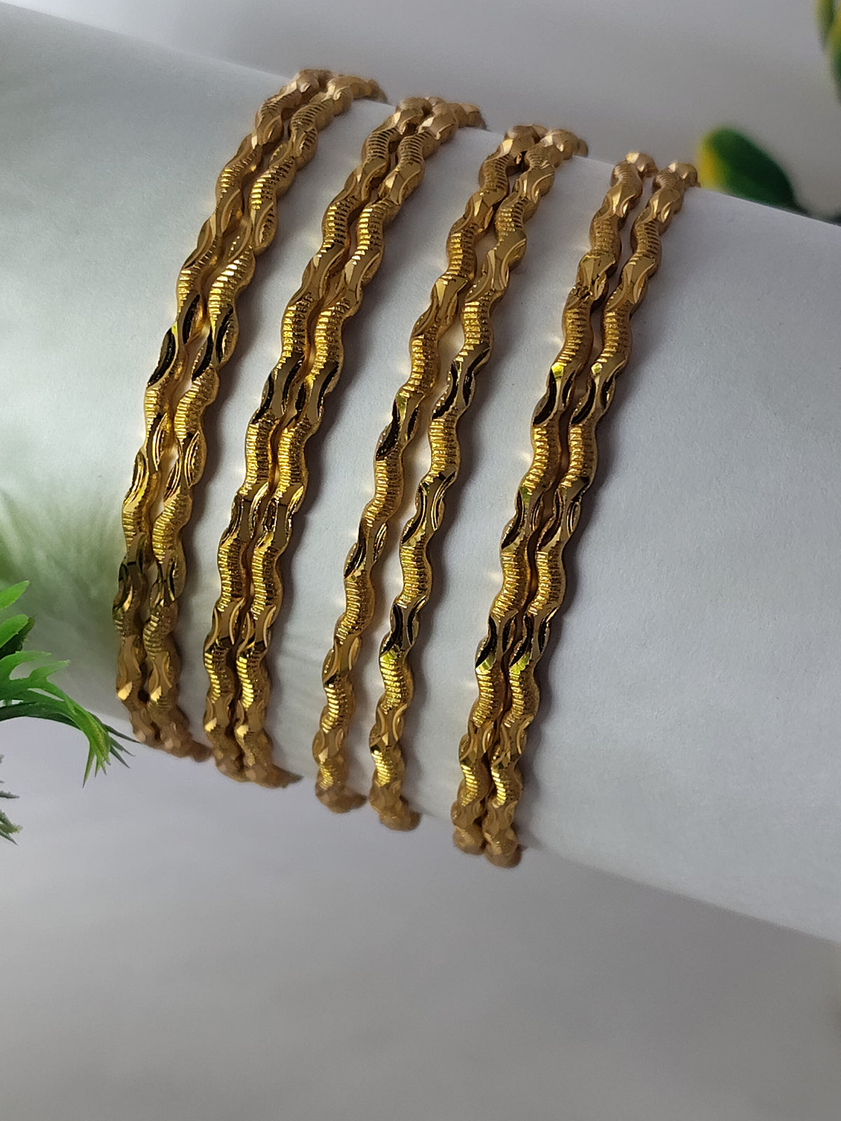 Elegant Gold-Plated Twisted Wave Designer Bangles for Women (Set of 8)